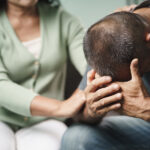 Female Psychologist, Friend Or Family Sitting And Put Hands On T