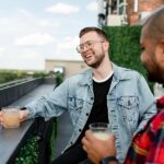 Online dating apps for gay people: find what you need in a few clicks Happy man having cocktail while on a date