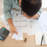 4 Canadian Debt Consolidation Options and How They Work The Butler Worried Hands Touch Forehead Which Has Many Expenses