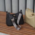Black and beige black on a wood bench with grey background