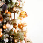Christmas Tree Close Up Standing White Wall Background Decorated