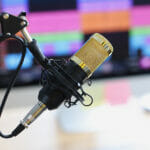 How AI Voices Complement the Voice Over Industry Professional sound recording studio with microphone and speaker. Audio voiceover or video recording concept.