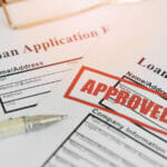 Loan approval, Loan application form with Rubber stamping that says Loan Approved, Financial loan money contract agreement company credit or person