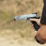 5 Tips for New Gun Owners Man In Tactical Clothes Shooting From A Pistol, Reloading The Gu