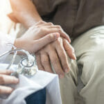 Parkinson disease patient, Alzheimer elderly senior, Arthritis person's hand in support of geriatric doctor or nursing caregiver, for disability awareness day, ageing society care service