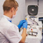 In A Modern Clinic Doctor Preparing A Prp For His Patient To Sta