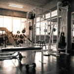 Why fitness is essential for men's health machine in gym with modern fitness equipment for fitness events and more. Modern of gym interior with equipment. Sports equipment in the gym.