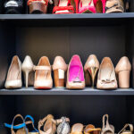 Personalized Gift Ideas for Your Fashion-Foward Wife Gray closet shelves full of fashion female shoes on heels pair storage organization of cupboard