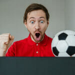 Who Is in The Golden Boot Race at Euro 2024? Young Excited Man Fan Support His Football Team Hold In Hand Soc