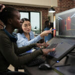 Play-to-Earn Game Development and Why It's Becoming The Next Big Thing Digital Interactive Entertainment Industry Workers Working With