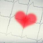 What Is The 30 Day Cardio Challenge? EKG graph.Electrocardiogram ekg ecg with red blurred heart.