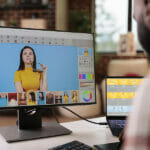 Review of VanceAI Productivity Series: Photo Editing for All African american editor using retouching software to edit photo, creating professional photography content. Freelancer artist editing image with color grading and retoucher interface.