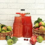 6 Top Benefits of a Juice Cleanse Apple And Pear Cider, Juice Or Bottled Fruit Drink On A Sunny Ta
