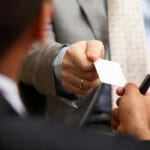 Closeup portrait of two successful business executive exchanging