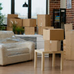 Travel Seasons, Closet Seasons, and Where Everything Goes Empty Household Space With Cardboard Boxes Used For Relocation,