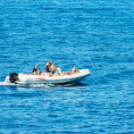 Inflatable Dinghy vs. Hard-Bodied Dinghy La Spezia, Italy – July 16, 2022: Motorized Dinghy With A Group