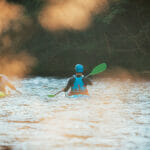 Why Is Inflatable The Best Choice For Most Whitewater Canoers? Two Whitewater Kayakers Paddling On The Waters Of River. Adrenal