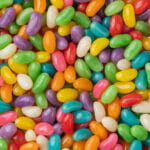 Get Creative with Jelly Beans! Closeup Top View Of Colorful Jelly Beans. Candy Backdrop.