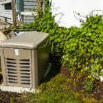 Residential Standby Generator On A Concrete Pad