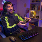 Happy Guy Gamer Wear Headphone Play Video Game Colorful Neon Lig