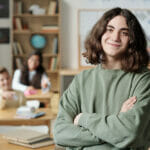 Secondary Schools Near Me: How To Choose the Right School for Your Kid Smiling Pre-teen Secondary School Learner In Sweatshirt Crossing