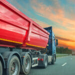 A Comprehensive Guide on the Mechanism of Dump Trailers Big Red Dump Truck Trailer Rides On The Highway, In The Sky The