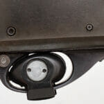 5 Ways to Safely Store Your Gun Close Up Of Trigger Lock On Pump-action Shotgun.