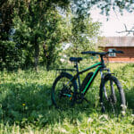 E-Bikes for All: Breaking Down Barriers to Cycling and Encouraging Active Lifestyles Electric Bike In Summer On A Sunny Day. E-bike Is A Modern Hybri
