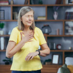 When to Worry About Lung Issues Older Woman At Home Doing Fitness Has Severe Shortness Of Breath