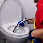 How Do I Know My Sewer Is Clogged? Plumber Unclogging Blocked Toilet With Hydro Jetting At Home Bat