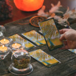 Seeking Psychic Advice with Confidence: A Legal Approach to Local Psychics Woman holds tarot cards in her hands. Concept of psychic advisor