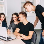 How to Build More Camaraderie in a New Startup Business Team Communication. Ideas Brainstorming. Young Male And