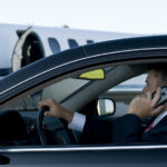 Types of Private Jets Businessman On Cell Phone In Luxury Car