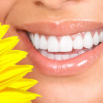 Happy smiling woman with a healthy teeth. Dentist.