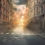 What Are Urban Survival Skills and Why Should You Develop Them? View of destruction city with fires and explosion over dramatic sky background