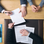 Nevada Business Laws Every Entrepreneur Should Know Couple Signing Marriage Documents
