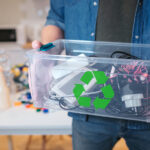 The Importance of Electronics Care: A Guide to Responsible Recycling with EACR Inc. for Young Adults Recycling Concept. An Electronic Waste In Recycling Contaner Clo