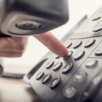 Rent Turkey Number: Seamless Communication Solutions Closeup Of Male Hand Holding Telephone Receiver While Dialing A