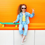 10 Tips to Pull the Perfect Holiday Outfit for Girls Fashion Kid. Stylish Little Girl Child Wearing A Jeans Clothes A