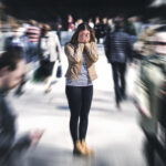 Panic Attack In Public Place. Woman Having Panic Disorder In Cit