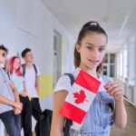 Student Teenager Female With Flag Of Canada Inside School, Child