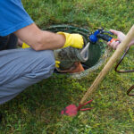 The Benefits of Regular Septic System Services for Homeowners Emptying Household Septic Tank. Cleaning Sludge From Septic Syst