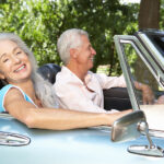 Senior couple in sports car