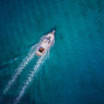 Vintage wooden boat in coral sea. Vintage boat. Vintage Yacht. Y