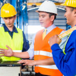 Is Group Outreach Safety Training Worth the Investment? Team of workers and engineer in Factory at production training