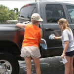 Mom & Daughter Washing Truck